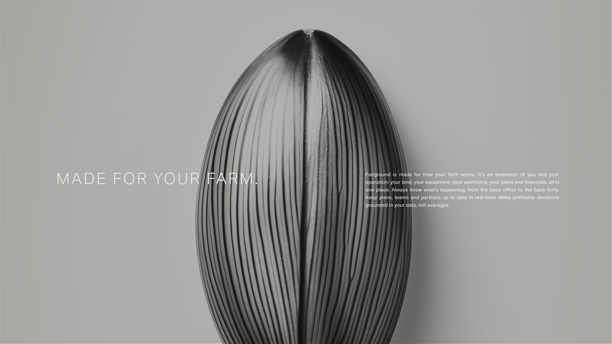 The display face set solid and small in pale type on a grey photographic ground, rather than as an outline.