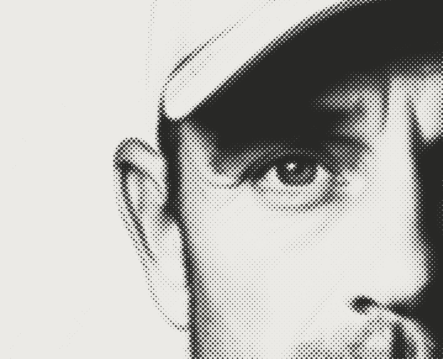 Scale three: a portrait cropped to an eye and a cap brim at extreme magnification, where a single halftone dot is enormous.