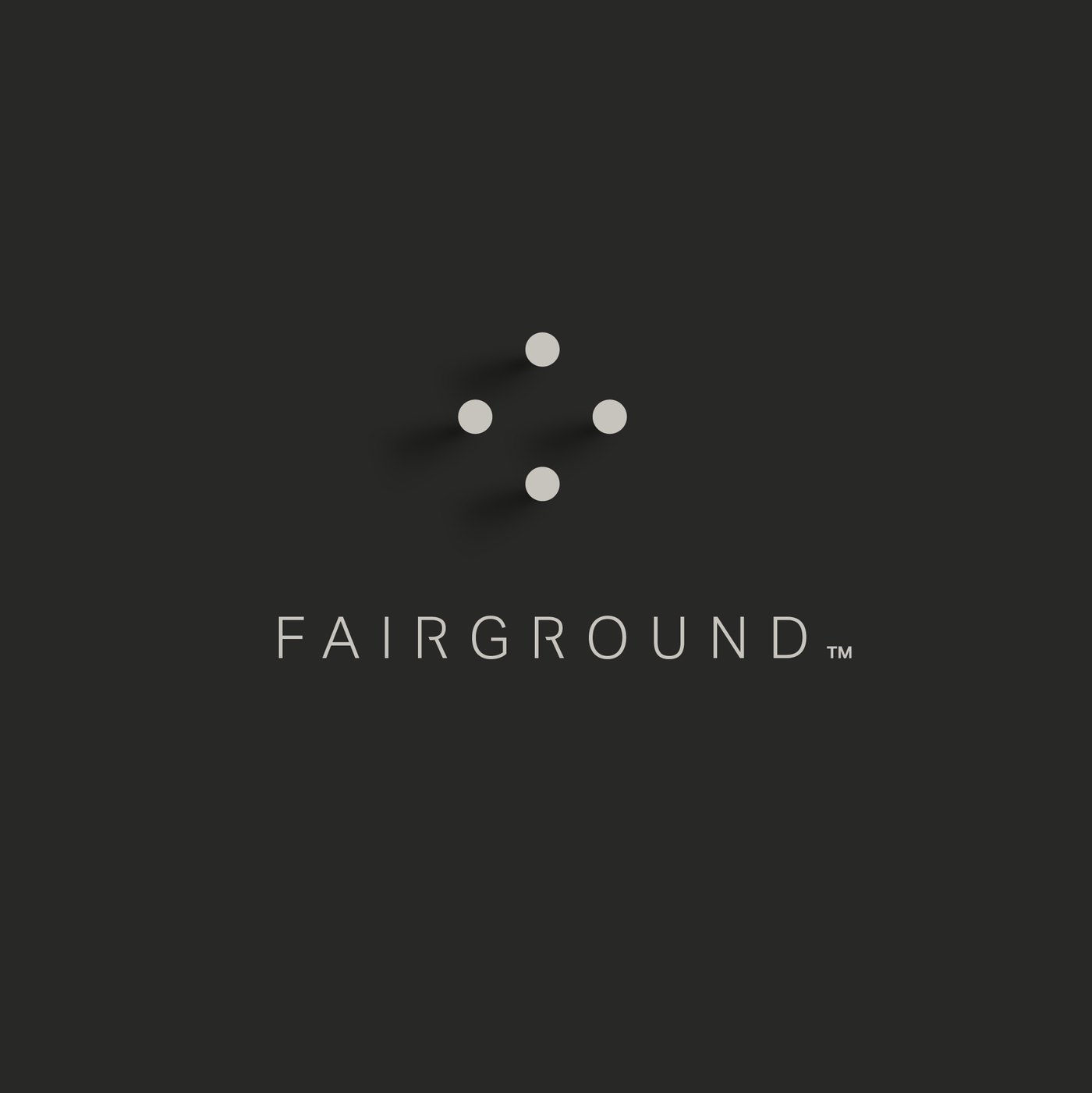 The Diamond lockup reversed out of a charcoal ground, the dots and wordmark rendered in a warm pale grey rather than bone.